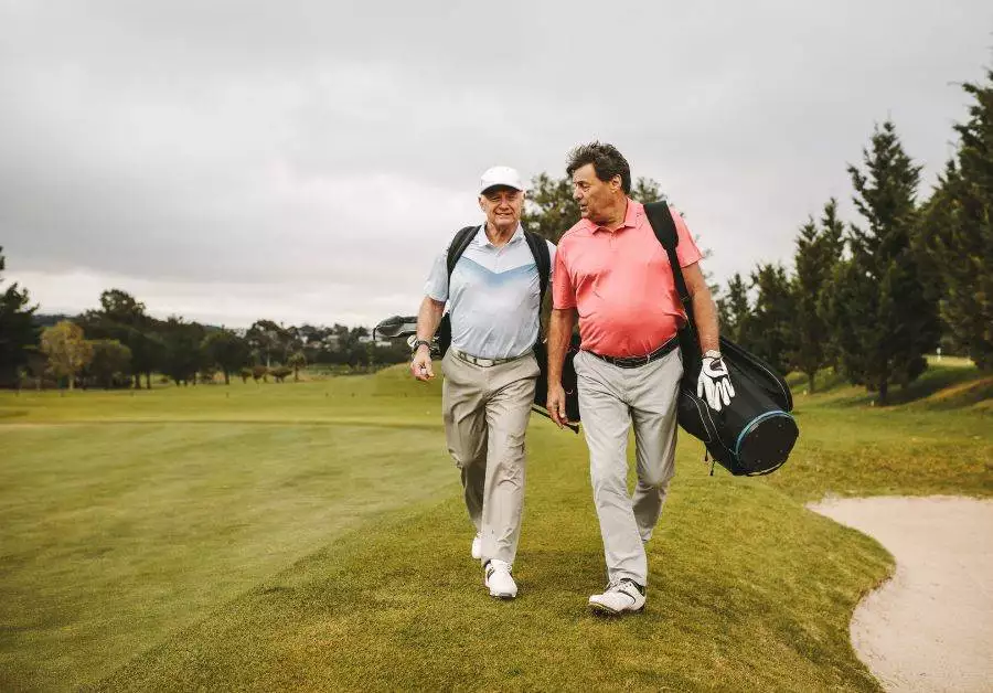 Golfers Carrying Bags